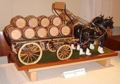 a horse drawn carriage filled with lots of barrels