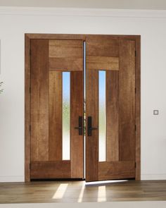 two wooden doors in an empty room