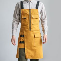 This item is for one apron only, all the other accessories are not included. Unisex Cooking Denim Apron with Pockets Buckle Strap Baking Barber Chef Work Size (as shown in the picture): hem width 60cm (23.62 inches), length 75cm (29.52 inches). Material: denim Color: as shown in the photos, please allow slight color difference. SKU: BAY-B992/JYY Work Clothes For Men, Art Aprons, Cafe Uniform, Jean Apron, Utility Apron, Work Apron, Chef Clothes, Denim Apron, Work Aprons