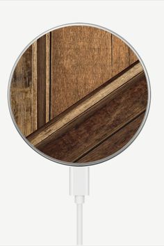 an image of a wooden surface in the shape of a round usb device charger