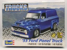 a blue truck with flames painted on it's front and back sides is in the box