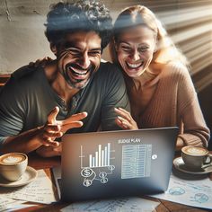 two people sitting at a table looking at a laptop screen with graphs on the screen