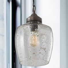 This 1-light pendant features a classic dome silhouette that makes a traditional statement in your living room, dining area, or entryway. The fixture is made from metal with a sleek solid finish. A single downward-facing bulb (sold separately) rests nestled within a clear stone-seeded glass shade. We love that this pendant light is compatible with dimmer switches, so you can easily control the level of brightness in your space. It hangs with the help of a height-adjustable chain and a canopy tha Seeded Glass Pendant Light, Kitchen Pendant, Kitchen Lights, Transitional Wall Sconces, Cool Floor Lamps, Kitchen Pendants