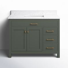 a bathroom vanity with marble top and gold handles