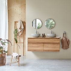 the bathroom is clean and ready for us to use it's natural wood accents