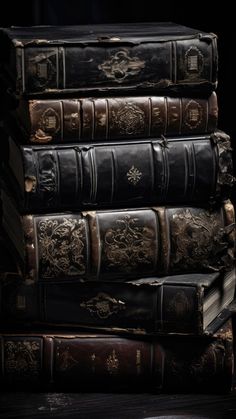 a stack of old books sitting on top of each other