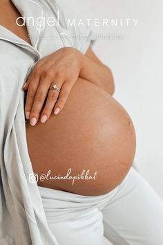 a pregnant woman with her hand on her belly