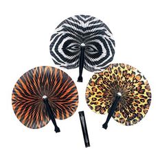 three decorative hand fans with animal print designs on the sides and black handles, all in different colors