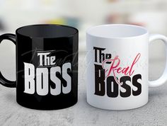 two black and white coffee mugs with the words the boss and the real boss printed on them