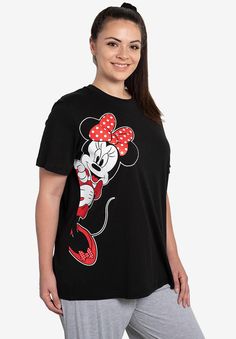 Minnie Mouse is front and center on this fun graphic tee. Soft cotton blend and an easy, relaxed fit makes this tee as comfortable as it is cute. Relaxed FitCrewneckFront graphicStraight hem29" lengthCotton/polyMachine washable, imported Approximate Measurements (laid flat):Across chest (underarm to underarm): 1X = 25", 2X = 27", 3X = 29", 4X = 31", 5X=33"Length (from back of neck to bottom hem): 1X = 29", 2X = 30", 3X = 31", 4X = 32", 5X=33" | Plus Size Women's Disney Women's Minnie Mouse Leani Disney Apparel, Plus Size Disney, Mouse Print, Plus Size T Shirt, Plus Size Fits, Cool Graphic Tees, Womens Tops Summer, Disney Ladies, Disney Outfits