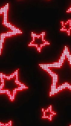 red and white stars are arranged in the shape of pixelated shapes on black background