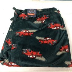 These St. John's Bay lounge pants for men are perfect for lounging around the house or sleeping in. They feature a fun vintage truck design in green with red accents and are made from soft and cozy microfleece fabric. The pants come in size large and are brand new with tags. The pants are categorized under Clothing, Shoes & Accessories, Men's Clothing, and Sleepwear & Robes. The brand is St. John's Bay and the size type is regular. When it comes to the department, these pants are designed for men. The aspect of fabric type is microfleece. Pajamas Men, Mens Lounge Pants, Men's Robes, Guys Clothing Styles, Sleep Pants, Truck Design, Vintage Truck, Pants For Men, New Trucks