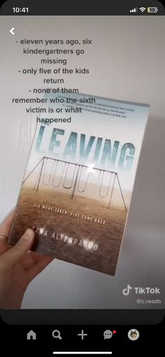 someone holding up a copy of the book i'm leaving now by alex knack