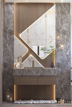 an elegant bathroom with marble walls and flooring, along with a large mirror on the wall