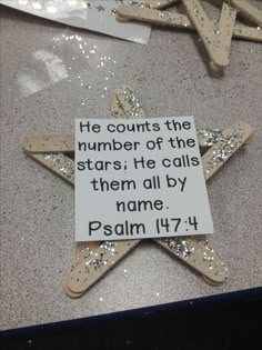 there is a star on the table with words written in it and some other items