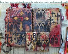 an altered book with cross designs on it and some other items next to it,