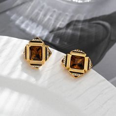 Square Glass Vintage Earrings Step back in time with our Square Glass Vintage Earrings, a stunning blend of classic design and modern elegance. These earrings are the perfect accessory for anyone looking to add a touch of sophistication to their wardrobe. Key Features: Unique Design: The square shape offers a contemporary twist on traditional vintage styles, making them a must-have for fashion-forward individuals. High-Quality Glass: Crafted from premium glass, each earring is designed for durab Classic Brown Jewelry With Matching Earrings, Elegant Brown Earrings For Anniversary, Modern Brown Earrings For Formal Occasions, Elegant Brown Evening Jewelry, Elegant Brown Jewelry For Formal Occasions, Elegant Brown Jewelry, Elegant Brown Crystal Earrings Gift, Vintage Jewelry Necklace, Amber Earrings