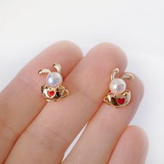 Cutest 14k gold filled bunny Heart stud earrings with faux pearl.  Made of highest quality hypoallergenic (non allergy) jewelry alloy. Dimensions: 0.59 x 0.39 inches / 1.5 х 1 cm Cute Gold Heart Earrings For Mother's Day, Cute Gold Heart Earrings For Gift, Gold Heart Earrings, Gold Heart-shaped Pearl Earrings For Pierced Ears, Valentine's Day Gold Pearl Heart Earrings, Heart-shaped 14k Gold Huggie Earrings For Valentine's Day, 14k Gold-filled Heart Earrings For Valentine's Day Gift, Valentine's Day Heart-shaped 14k Gold Huggie Earrings, Gold Heart Earring