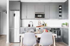 the kitchen is clean and ready to be used as a dining room or office space