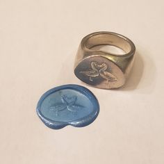 This signet ring is cast in lead-free pewter. The ring size when cast is 7.25 . The sealing image is a couple of geese kissing.       This is part of a series of signet rings I am making cast from lead-free pewter. Each master ring is hand sculpted to give a unique, rustic style, multi-dimensional relief image when used as a stamp to seal, with sealing wax. Couple Signet Rings, Unique Bezel Settings, Wax Seal Ring Men, Handmade Silver Signet Ring As Gift, Unique Signet Ring For Promise With Lost Wax Casting, Signet Wedding Ring, Signet Ring Wax Seal, Wax Carved Ring Silver Signet, Lost Wax Casting Rings