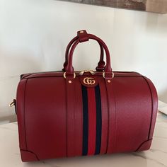 Dimensions: 17.3"W X 11.2"H X 9.6" Brand New With All The Accessories High-end Red Business Bag, Designer Red Business Bag, Luxury Red Gucci Bag, Red Leather Luxury Travel Bag, Red Rectangular Bags For Business Trips, Luxury Red Leather Travel Bag, Rectangular Red Bags For Business Trips, Luxury Red Bags With Leather Lining, Luxury Red Travel Bag For Everyday Use