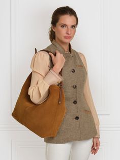 Our stylish and spacious shoulder bag, the Tetbury is part of a much-loved family. With a slouchy silhouette, and a range of carefully-considered style touches, it feels relaxed yet refined. Wear slung over your shoulder for days out or the office. Handcrafted in Spain, from soft sustainably sourced materials, we’ve added touches like the braided over-shoulder handle, and understated branding detail, such as shiny light gold shield hardware and an embossed logo. The microfibre-lined large compar Slouchy Tote Bag, Slouchy Hobo Bag, Gold Shield, Boot Tree, Fairfax And Favor, Slouchy Tote, Perfect Tan, Suede Handbags, Tan Suede