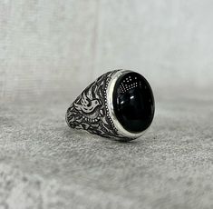 Old Rare Black Stone Ring Yemeni Stone Silver Ring Shia Ring Black Yamani Ring Mens Mothers Day Gift Silver Ring Fine Mens Black Stone Ring * Total Carat: 10 Carat * Total Weight Silver: 20 grams * Ring Sizes: All US, UK International Size Available (5US,6US,7US,8US,9US,10US,11US,12US,13US,14US,15US,16US) * Re-sizable: Yes * Type: Natural Unheated Untreated Gemstone * Shipment Via FedEx Note: Stone Color as seen on the Store We take the photos mostly in a Natural Daylight Night Light condition a Black Oval Rings For Promise, Oval Black Rings For Promise, Black Oval Promise Ring, Oval Black Promise Ring, Classic Black Adjustable Signet Ring, Classic Black Gemstone Ring, Black Signet Ring With Polished Finish For Promise, Adjustable Black Signet Ring With Polished Finish, Classic Adjustable Black Enamel Rings