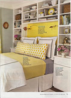 a bedroom with yellow and white decor on the walls, bookshelves and bedding