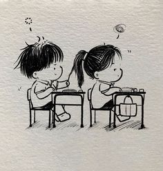 two children are sitting at a table and one is writing