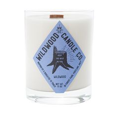 a candle that is sitting in front of a white background with the words wildwood candle co on it