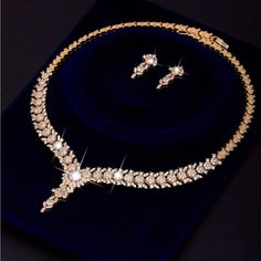 This Is A Beautiful 18k Gold Plated Cubic Zirconia Set With A Detailed Necklace And Earrings Set. The Set Is So Intricate And Perfect For An Evening Event Or Date!! Pearl Cluster Necklace, Silver Statement Earrings, Detailed Necklace, Crystal Choker Necklace, Zirconia Necklace, Wood Bracelet, Cubic Zirconia Necklace, Necklace And Earrings Set, Crystal Choker