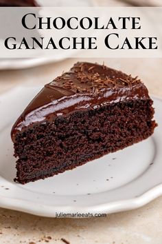 a slice of chocolate ganache cake on a white plate