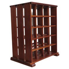 a wooden book shelf with several shelves on each side