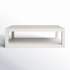 a white coffee table sitting on top of a white floor