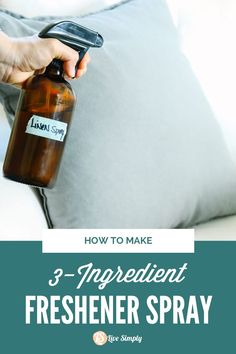 a person holding a bottle with the text how to make 3 - ingredient freshener spray