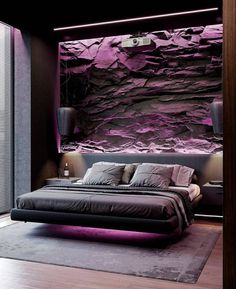 a bedroom with a large bed in front of a purple rock wall