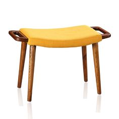 an upholstered stool with wooden legs and a yellow seat pad on the back