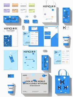 various stationery items are arranged on a white surface with blue accents and the letter k