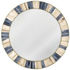 a round mirror with blue and white stripes