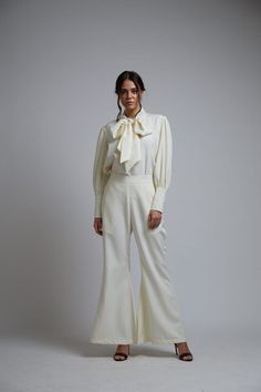 Editor's Note Featuring a white crepe bell-bottom pants. Color: White Fabric: Crepe Care: Dry Clean Only About the Designer KoAi means "Love Child" Non-fussy clothes for everyday wear. These pieces can be worn at any time of the day.i.e for work, brunch, evening wear, by the pool. Basically everywhere. White Wide Leg Flares For Spring, Chic White Fitted Flares, Chic Fitted White Flares, Chic White Wide Leg Flares, Chic White Wide-leg Flares, White Chic Wide Leg Flares, White Flared Formal Bottoms, White Flare Wide Leg Pants For Spring, White Flare Wide Leg Pants For Work