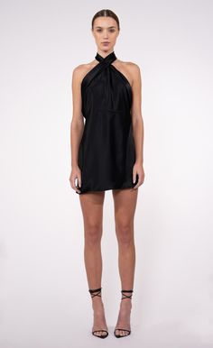 Expertly crafted for the modern woman, the Gigi Dress boasts a sexy crossed halter neck and sheer elegance. With a low back and timeless design, this LBD is a must-have for every wardrobe, adding a touch of sophistication and allure to any occasion. Black Teva, Gigi Dress, Mood Indigo, Engineered Garments, Black Crop Tops, Low Back, Designer Outfits Woman, Dresses Xs, Halter Neck