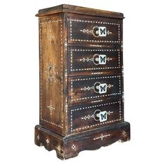 an old wooden chest with metal studding on the top and bottom drawers, isolated against a white background