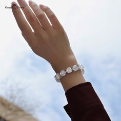 Luxurious Moissanite Diamond Bracelet Experience luxury with this stunning 85ct Moissanite Diamond Bracelet. Featuring 11mm round VVS1 clarity stones with D color grade, set in 18K white gold-plated 925 silver. This 19cm bracelet offers unmatched brilliance and elegance.