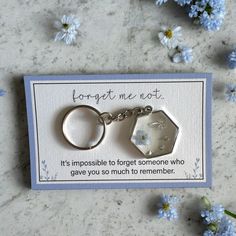 a keychain that says forget me not it's impossible to forget someone who gave you so much to remember