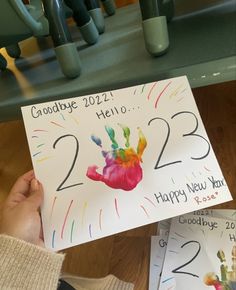 someone holding up a handprint for their new year