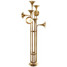 the brass trumpet lamp has four lights on each side