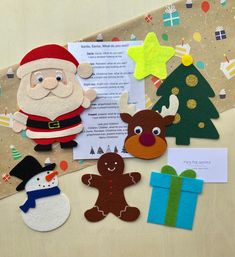 paper cutouts and felt christmas decorations are displayed on a sheet of paper with santa's helper