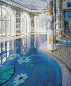 an indoor swimming pool with flowers painted on it