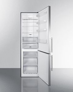 an open refrigerator freezer sitting on top of a counter next to another one with its door open