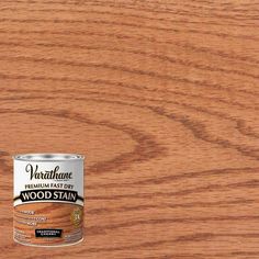 a can of wood stain sitting on top of a wooden table